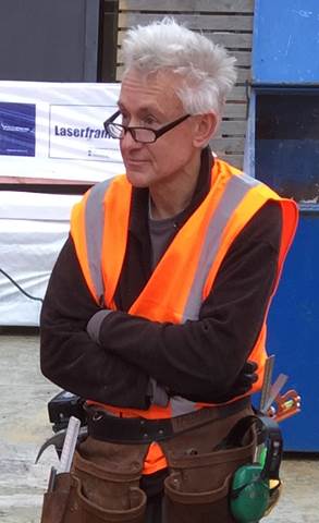 A picture containing person, outdoor, orange

Description automatically generated